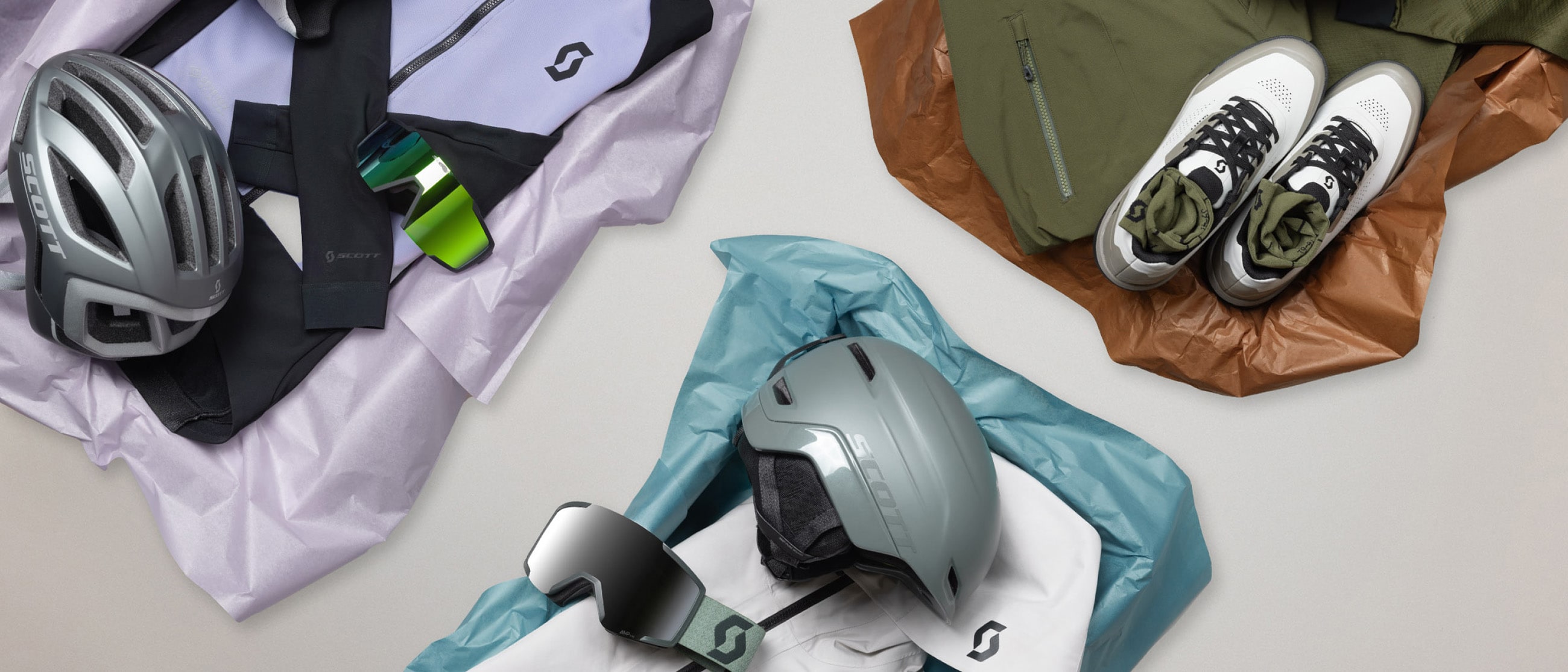 selection of bike, ski and running cloths layed on the floor